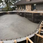 concrete bottom layer of a custom pool